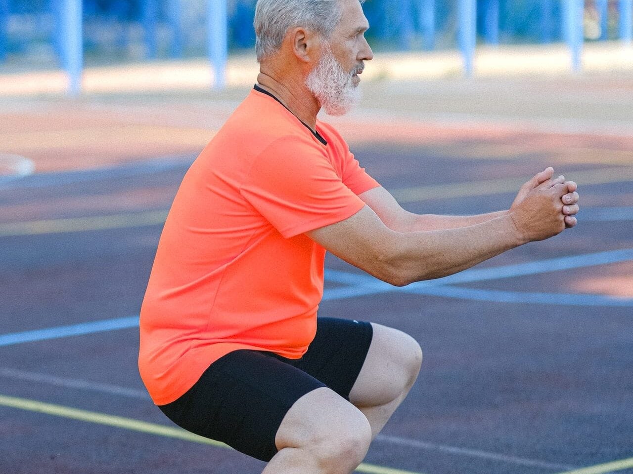 Elderly person performing knee exercises for pain