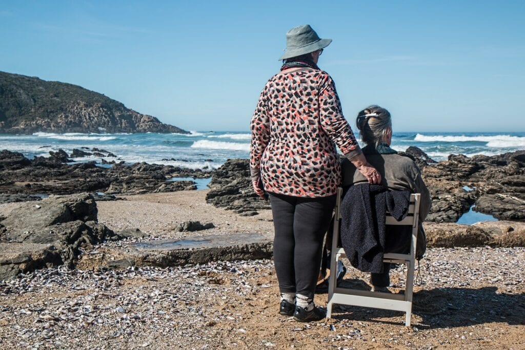 The duties of a caregiver may take you to the beach as is the case here.