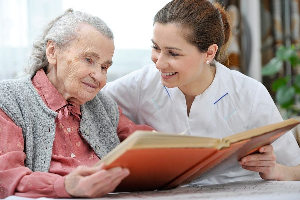 Elderly care for parents at home by paid caregive.