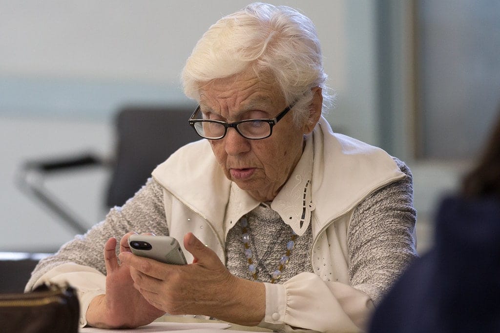 Lady using technology to assist with aging in place.